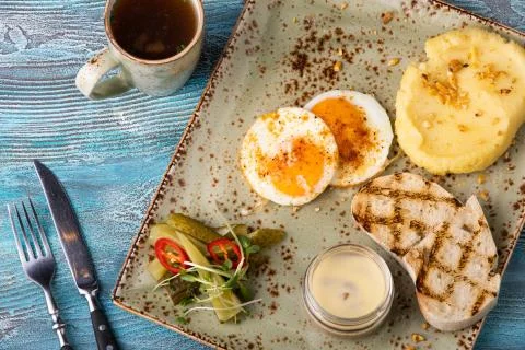 Breakfast potatoes mashed with egg and toast Stock Photos