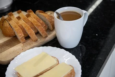 Breakfast preparation being prepared in a kitchen. Stock Photos
