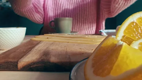 Breakfast Preparation with Fresh Bread Cheese and Citrus Fruit on Wooden Table 库存影片 331098705