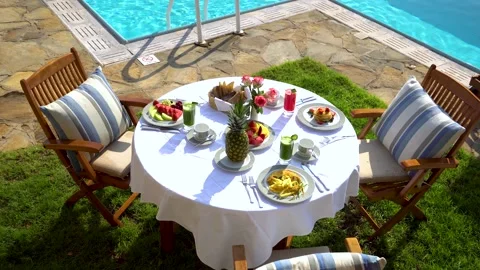 Breakfast on Private Poolside. Exclusive Luxury Resort With Splendid View on Sea Stock Footage 145410273