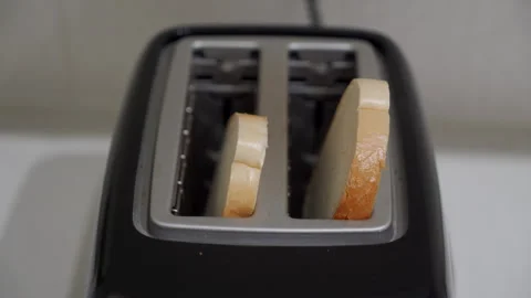 Breakfast Is Ready: Toaster Pops Up Crispy Toast with Satisfying Sound. 動画素材 320848767