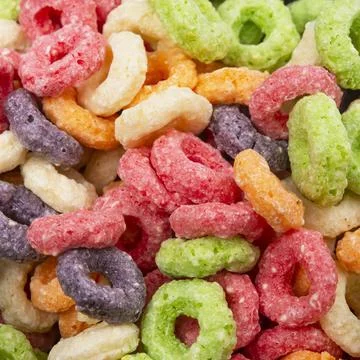 Breakfast rings flake circles multicolor background food Stock Photos