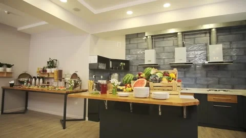 Breakfast room in a small hotel. Served table with sausages, meat, salads Stock Footage 262850937