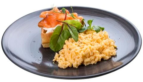Breakfast. Scrambled eggs with salmon Stock Photos