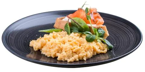 Breakfast. Scrambled eggs with salmon Stock Photos
