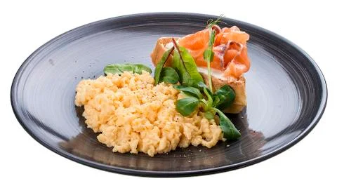 Breakfast. Scrambled eggs with salmon Stock Photos