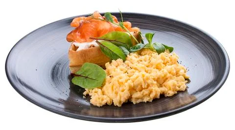 Breakfast. Scrambled eggs with salmon Stock Photos