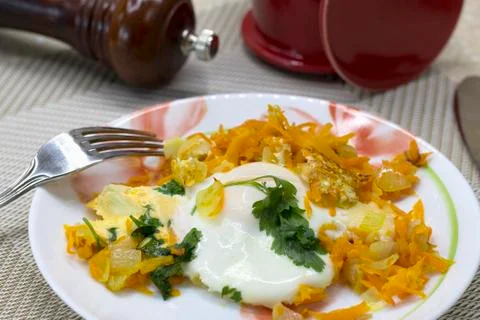 Breakfast of scrambled eggs, vegetables, cheese and parsley Stock Photos