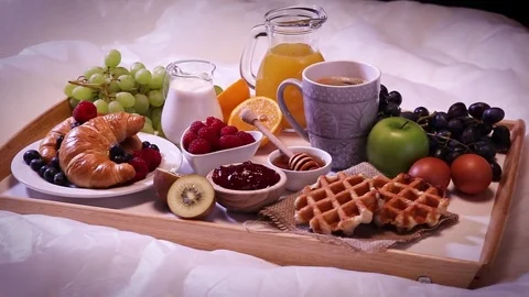 Breakfast served with coffee, orange juice, croissants and fruits. Stock Footage 80678620