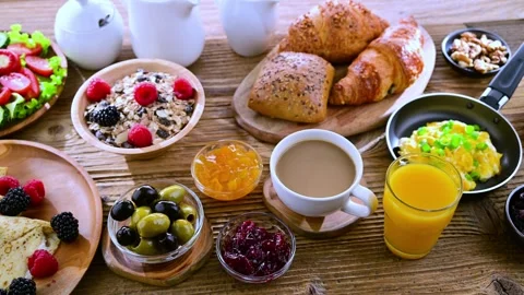 Breakfast served with coffee, orange juice, croissants, cereals and pancakes Stock Footage 281861033