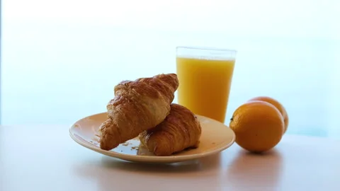 Breakfast served with coffee, orange juice, croissants, cereals Stock Footage 316096127