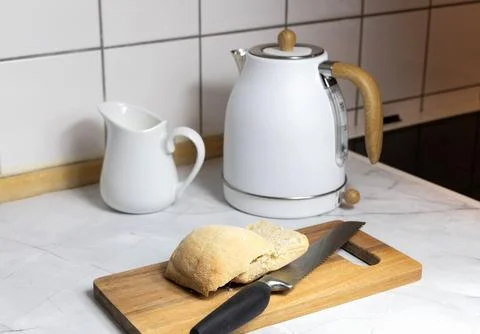 Breakfast served on the kitchen table Stock Photos