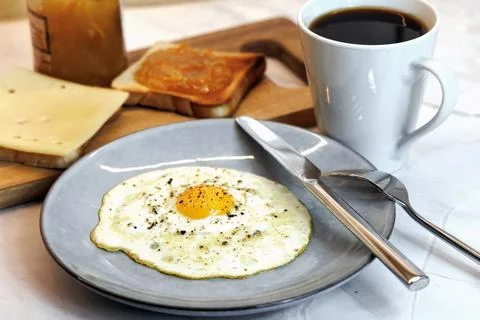 Breakfast served on the kitchen table Stock Photos
