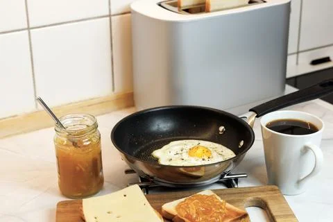 Breakfast served on the kitchen table Stock Photos