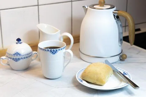 Breakfast served on the kitchen table Stock Photos