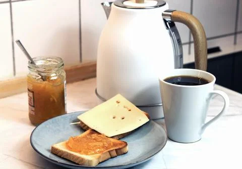 Breakfast served on the kitchen table Stock Photos