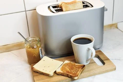 Breakfast served on the kitchen table Stock Photos