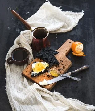 Breakfast set. Black bread toasts with tangerine marmelade and mascarpone che Stock Photos