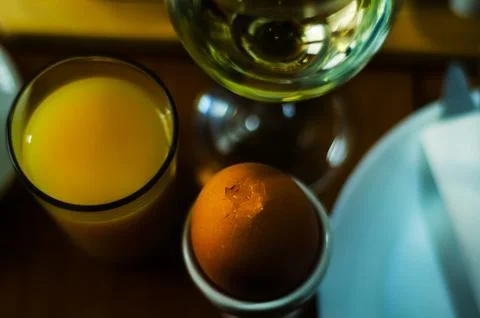 Breakfast set with egg in egg-cup, fresh bread, healthy and tasty food Stock Photos