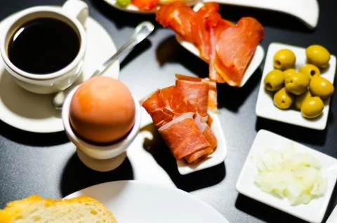 Breakfast set with egg in egg-cup, fresh bread, healthy and tasty food Stock Photos