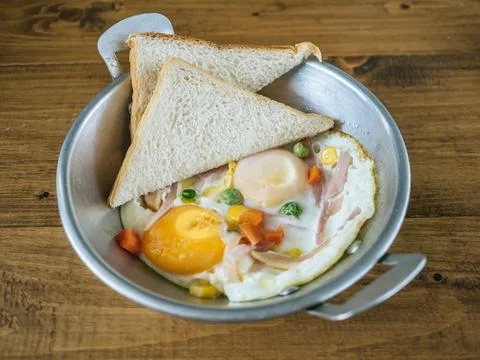 Breakfast set of fried egg and breads. Stock Photos