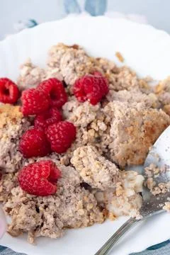 Breakfast setup with hot beverage, sliced fruit, and oatmeal served on patt.. Stock Photos
