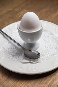Breakfast with soft-boiled egg, over old wooden table. Stock Photos