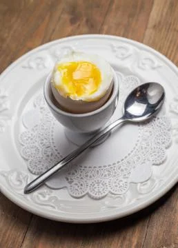 Breakfast with soft-boiled egg, over old wooden table. Stock Photos
