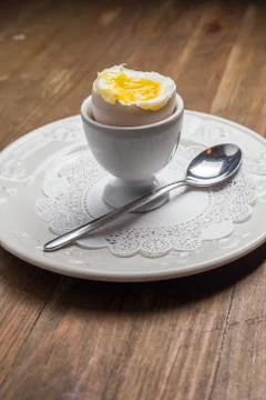 Breakfast with soft-boiled egg, over old wooden table. Stock Photos