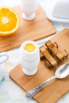 Breakfast with soft boiled eggs and toast soldiers Stock Photos