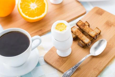 Breakfast with soft boiled eggs and toast soldiers Stock Photos
