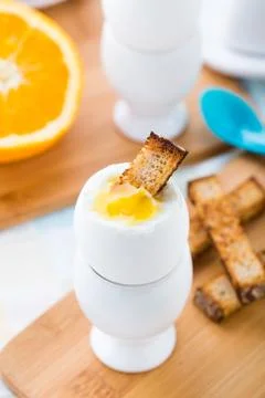 Breakfast with soft boiled eggs and toast soldiers Stock Photos