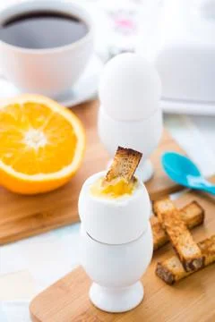 Breakfast with soft boiled eggs and toast soldiers Stock Photos