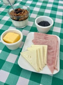 Breakfast spread on a checkered tablecloth Stock Photos