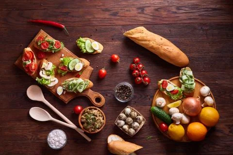 Breakfast still life with sandwiches, quail eggs, spicies and fresh fruits and Stock Photos