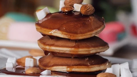 Breakfast. Syrup pours on the pancake nice and slow. Slow motion. Bright blurred Stock Footage