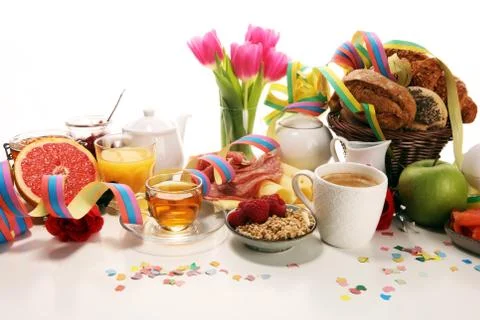 Breakfast on table with bread buns, croissants, coffe and juice on carnival Stock Photos