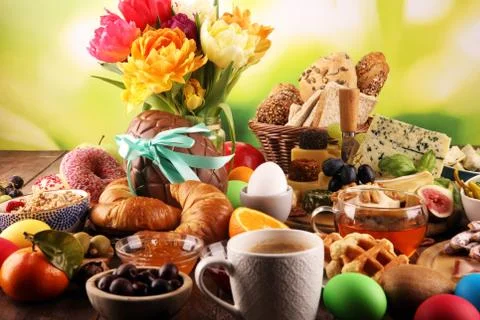 Breakfast on table with bread buns, croissants, coffe and cheese Stock Photos