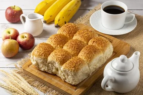 Breakfast table with coconut bread and fruits. Stock Photos