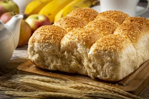 Breakfast table with coconut bread and fruits. Stock Photos