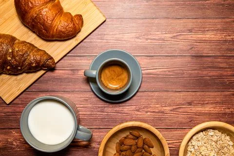 Breakfast table with a cup of espresso coffee in the center Stock Photos