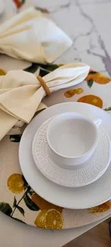 Breakfast table decorated with white cup and napkins Foto stock