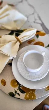 Breakfast table decorated with white cup and napkins Stock Photos