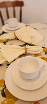 Breakfast table decorated with white cup and napkins Stock Photos