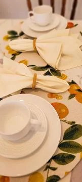 Breakfast table decorated with white cup and napkins Stock Photos