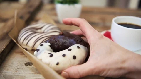 Breakfast table with donuts and coffee Video stock 84729008