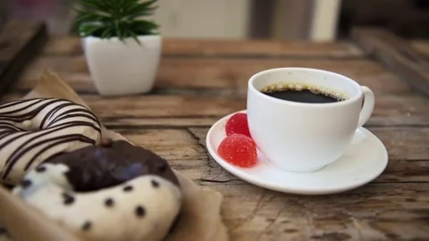 Breakfast table with donuts and coffee Stock Footage 84828317