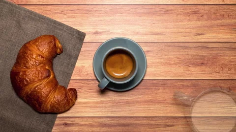Breakfast table with espresso, milk and croissant.  Stock Footage 202144865