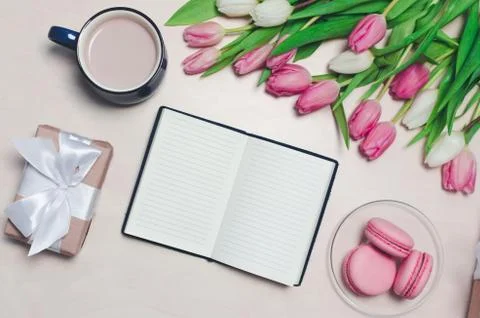 Breakfast on table. flat lay composition with flowers, a notepad a cup o coff Stock Photos