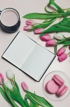 Breakfast on table. flat lay composition with flowers, a notepad a cup o coff Stock Photos